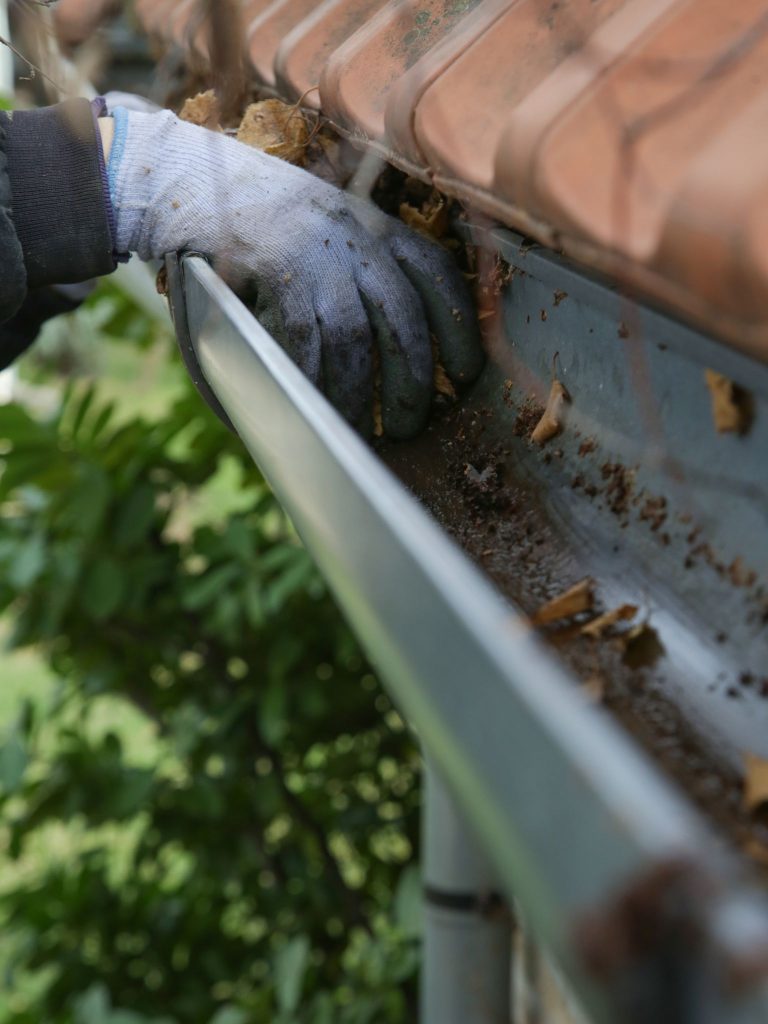 Cleaning debris from gutters